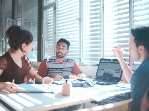 Three students studying together. Photo Credit: HTWG.