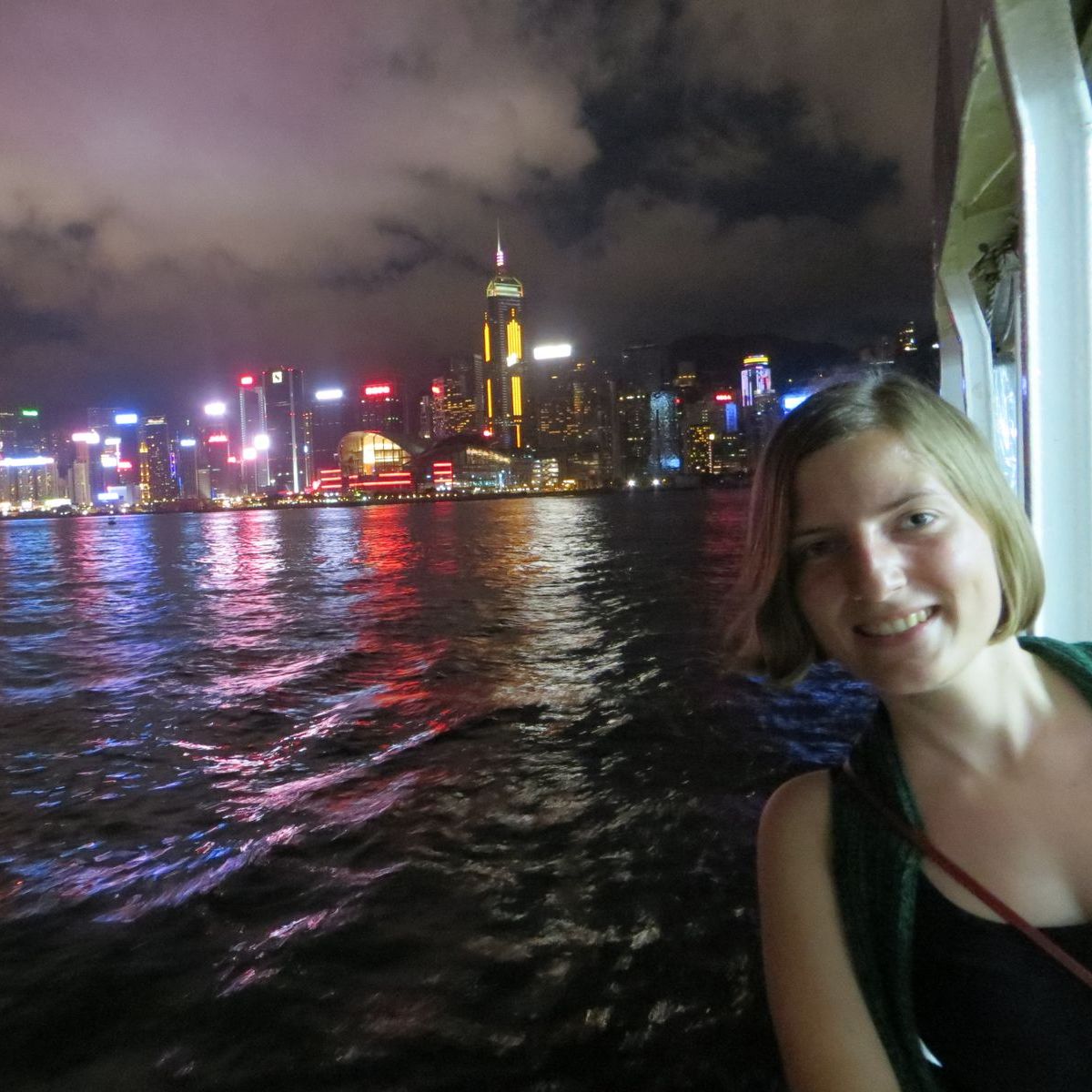 Friederike Haase standing in front of the Shanghai skyline.