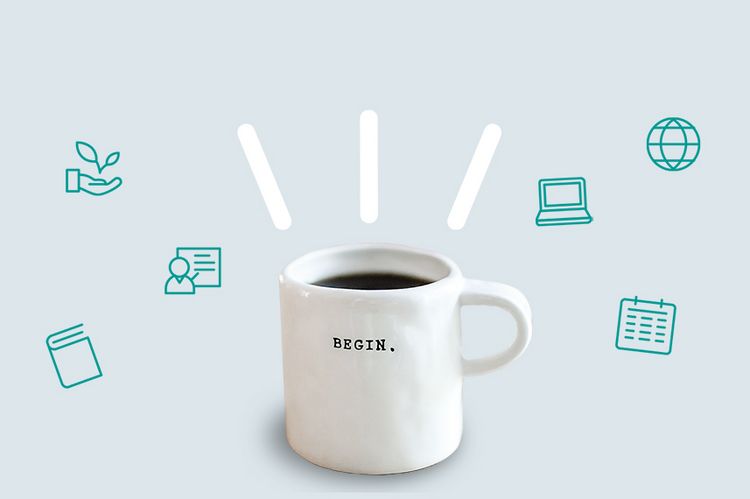 Ein weißer Kaffeepott steht vor einem grauen Hintergrund. Auf dem Pott steht "Begin"