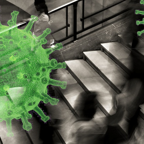 background black and white, people on stairs, blurred; foreground: a huge green virus 