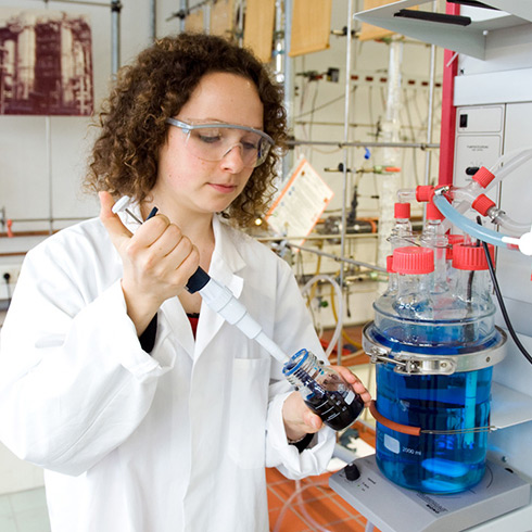 Female student working in the lab Female student working in the lab