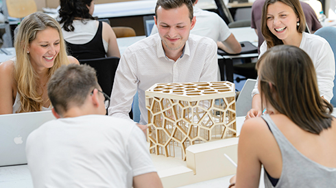 Students with an architectural model 